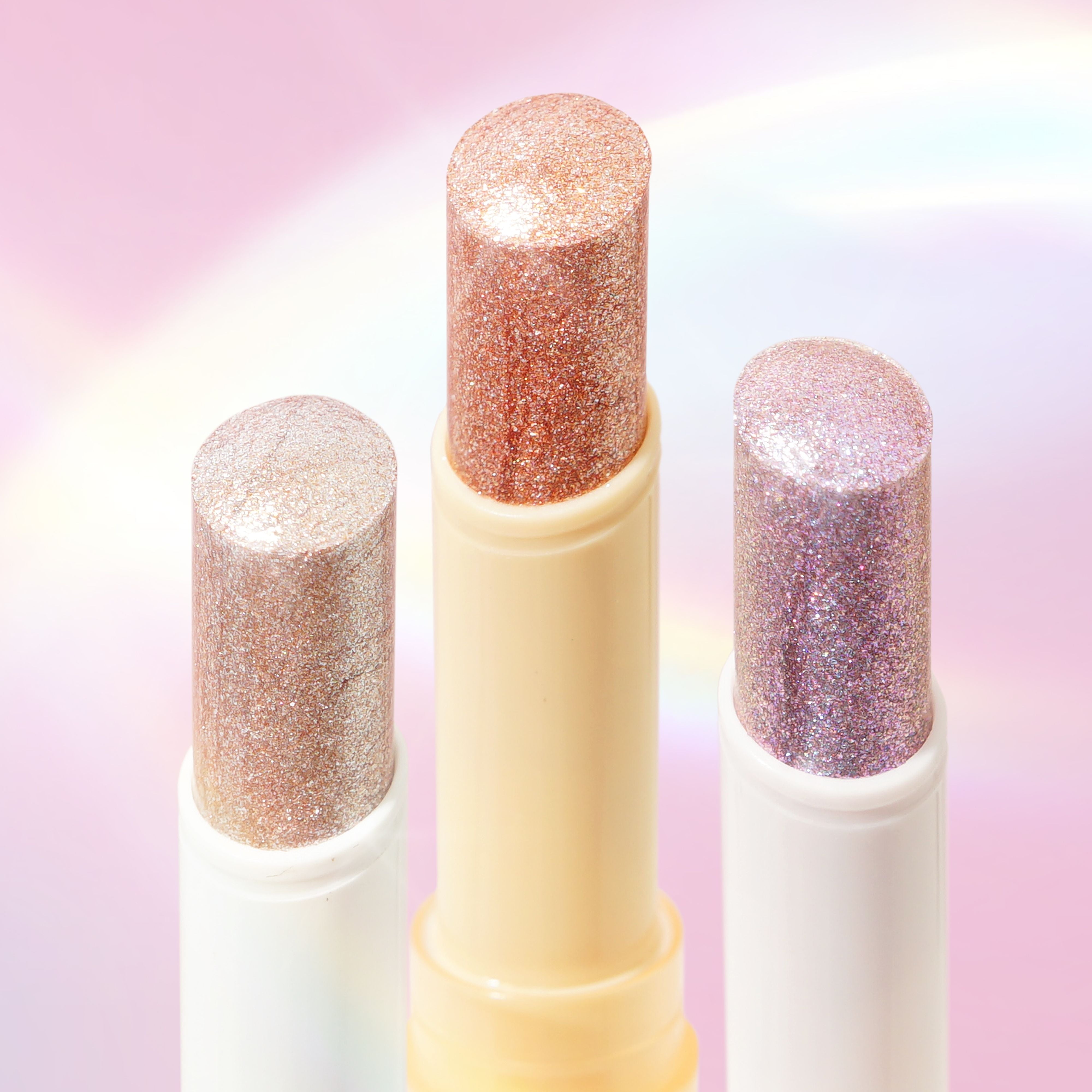 Profusion Cosmetics Jelly Beam Jelly Shimmer Stick for face, showcasing its shiny, iridescent surface and slim, portable design.
