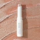 Profusion Cosmetics Jelly Beam Jelly Shimmer Stick for face, with a smooth, luminous pink glow and shimmering finish.