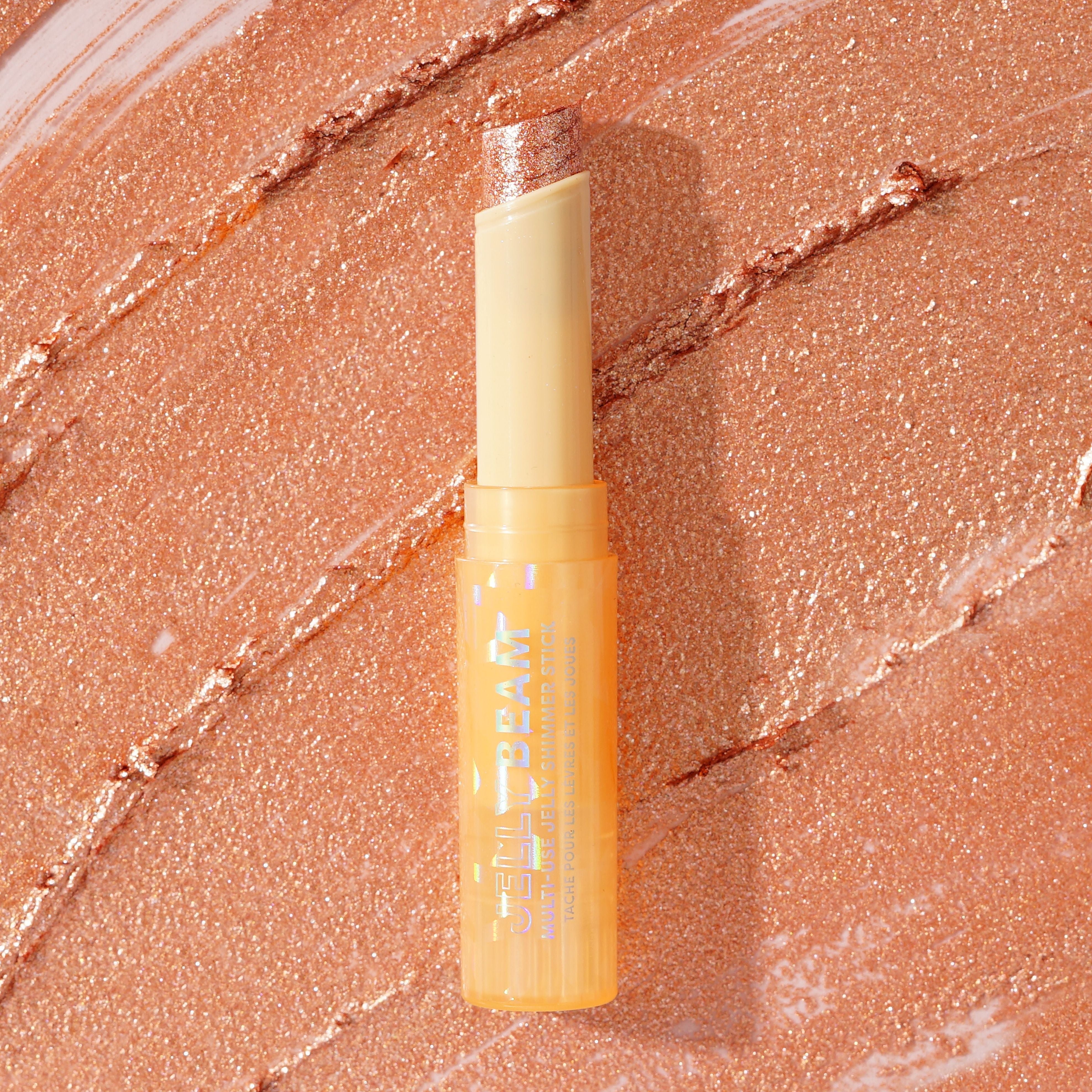 Profusion Cosmetics Jelly Beam Jelly Shimmer Stick for face, featuring a shimmering, jelly-textured highlighter on a neutral background.