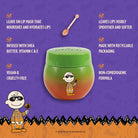 Profusion Cosmetics Peanuts Halloween Apple Bobbing Overnight Lip Mask applied on lips with festive packaging in the background.