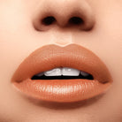 Profusion Cosmetics Perfect Pout Soft Matte Lip Tint on lips, showcasing a smooth, matte finish with a natural pink shade.