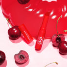 Profusion Cosmetics Jelly Drop Lip and Cheek Stain in Coral Crush, showcasing a vibrant, glossy lip and cheek color.