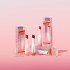 Profusion Cosmetics Glimmer Balm Hydrating Melting Lip Balm in coral shade showing smooth, glossy lips with a hint of shimmer.