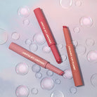 Profusion Cosmetics Dreamy Lip Plump in cozy nude, featuring glossy lips with a smooth, plumped appearance.