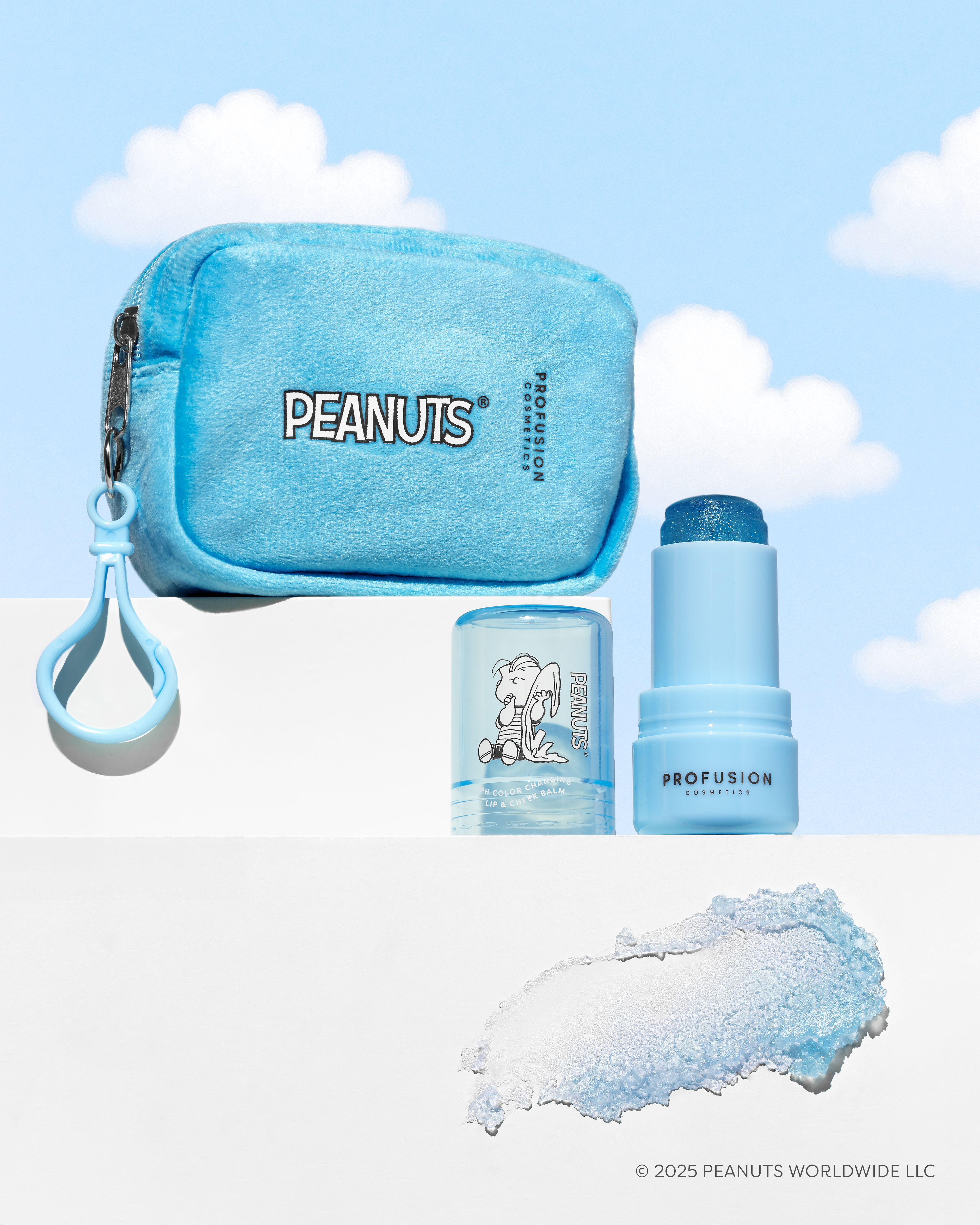 Profusion Cosmetics Peanuts 75th Linus’s Cozy Tint color-changing lip balm in a security blanket pouch with lips and Peanuts logo.