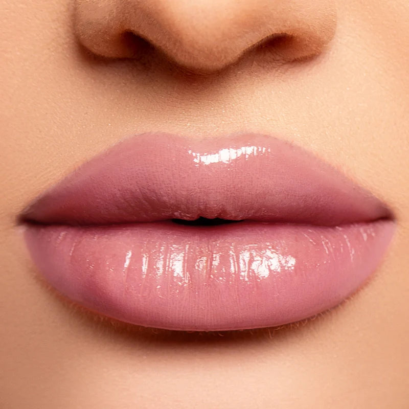 Delicate hydrating liquid lip gloss by Profusion Cosmetics, featuring a glossy, smooth finish on lips.