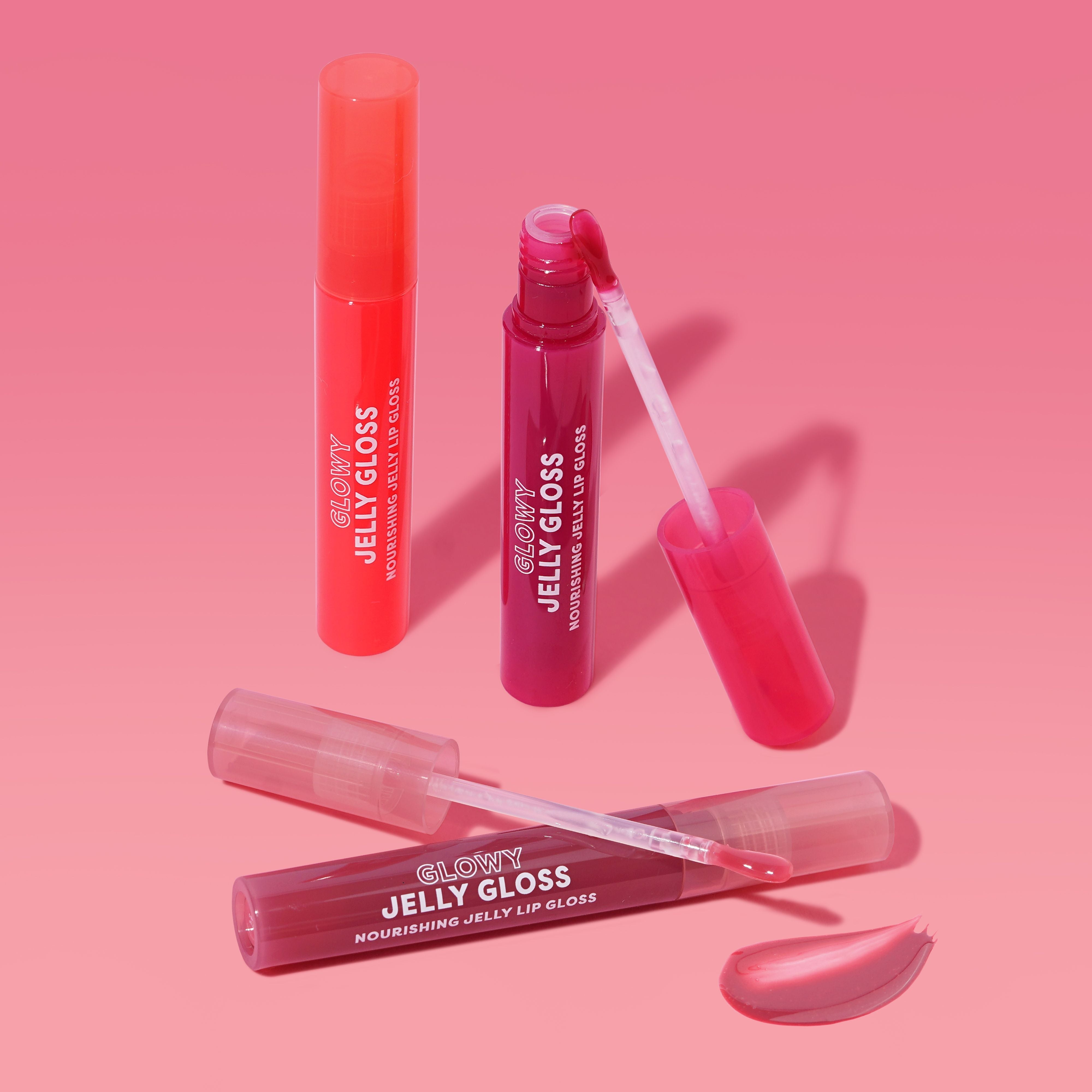 Profusion Cosmetics Glowy Jelly Gloss on lips with a glossy, nourishing guava-flavored finish, highlighting a vibrant, shiny lip look.