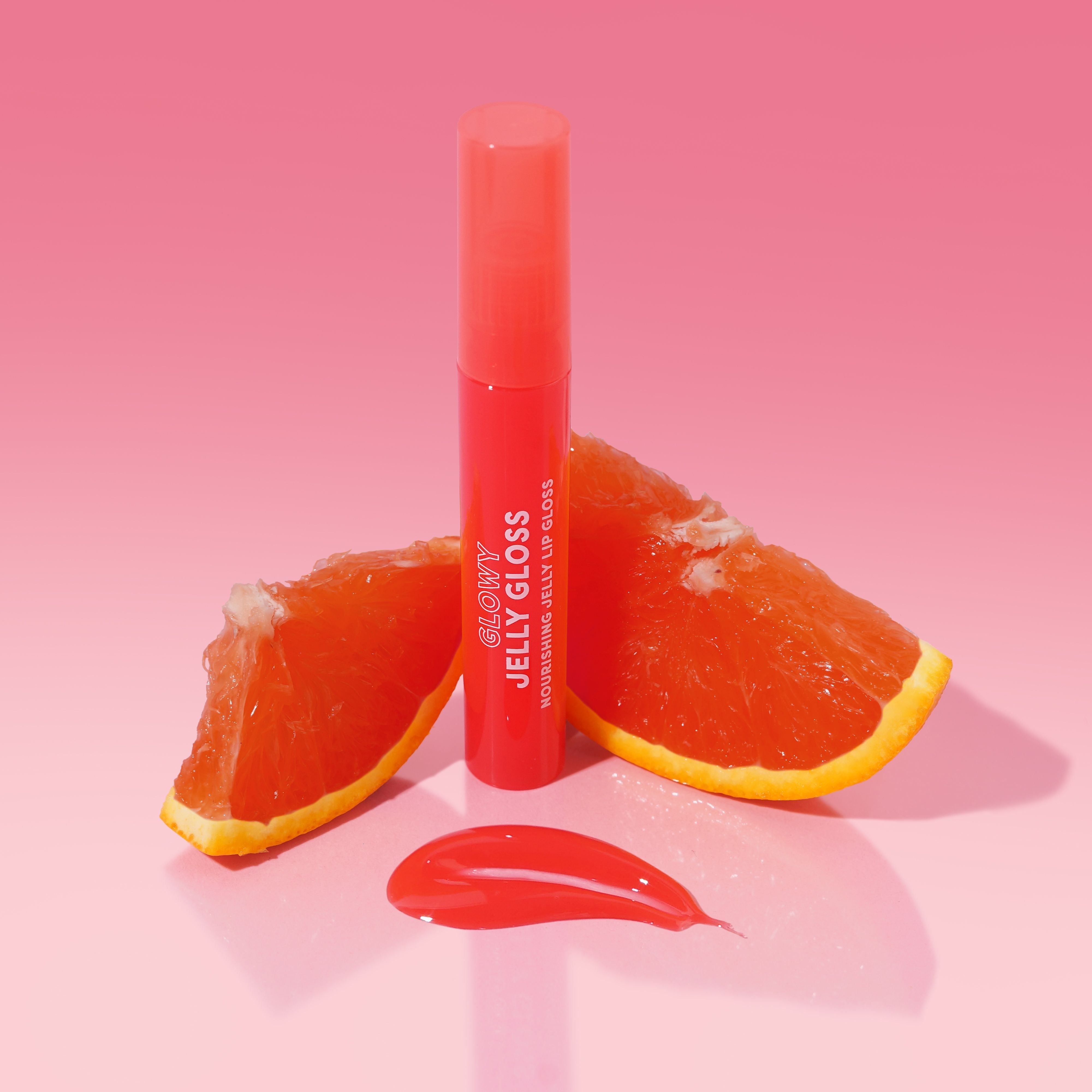 Profusion Cosmetics Guava Glowy Jelly Lip Gloss on lips, showcasing a nourishing, shiny pink lip look with a glossy finish.