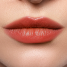 Profusion Cosmetics Lip Glaze Hydrating Lip Stain applied on lips with a glossy, natural finish and light pink color.