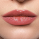 Profusion Cosmetics Lip Glaze Hydrating Lip Stain applied on lips with a glossy maple color finish.