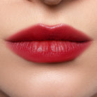 Profusion Cosmetics Lip Glaze Hydrating Lip Stain on lips with a glossy finish and warm maple hue.