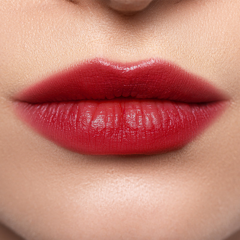 Profusion Cosmetics Lip Glaze Hydrating Lip Stain on lips with a glossy finish and warm maple hue.