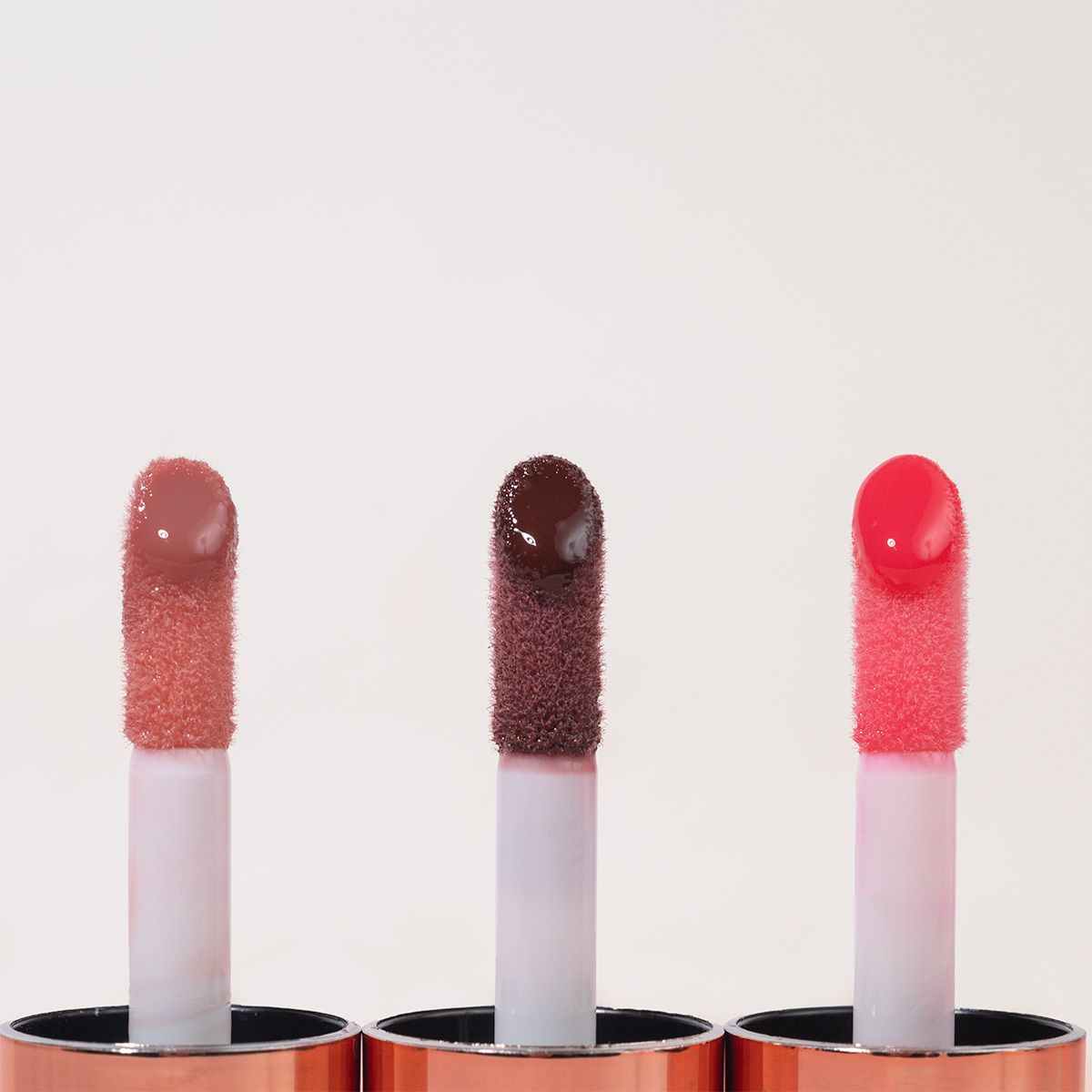 Profusion Cosmetics Juicy Lips in Radiant Rose showcasing vibrant pink lipstick on smooth lips.