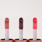 Profusion Cosmetics Juicy Lips in Radiant Rose showcasing vibrant pink lipstick on smooth lips.