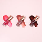 Profusion Cosmetics Juicy Lips in Radiant Rose, showing glossy, vibrant pink lips with a smooth finish.