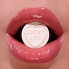 Profusion Cosmetics Juicy Lips in Radiant Rose, close-up of vibrant pink lip gloss on smooth lips.