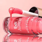 Profusion Cosmetics Juicy Lips in Radiant Rose, close-up of shiny pink lips with glossy finish.