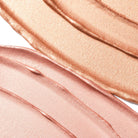 Profusion Cosmetics Radiant Glow Illuminating Liquid Highlighter in Champagne shade, showing a sleek bottle with liquid highlighter inside.