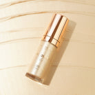 Profusion Cosmetics Radiant Glow Illuminating Liquid Highlighter in champagne shade, showcasing a sleek bottle and luminous finish.