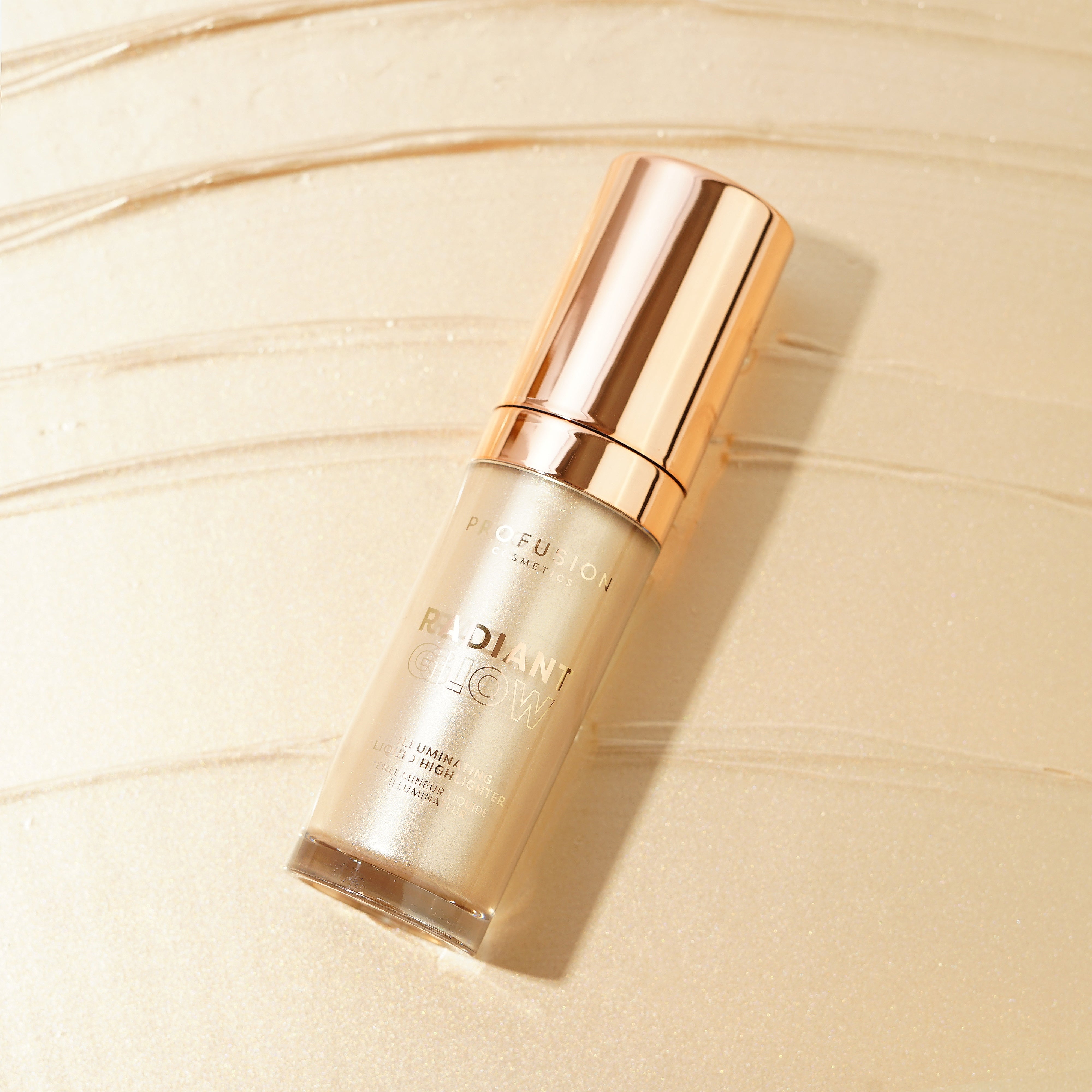 Profusion Cosmetics Radiant Glow Illuminating Liquid Highlighter in champagne shade, showcasing a sleek bottle and luminous finish.