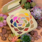 Profusion Cosmetics Desert Sage 25-Shade Makeup Palette with brushes, featuring vibrant eyeshadow colors and applicator tools.
