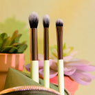 Profusion Cosmetics Desert Sage makeup brushes set with 4-piece bag and stand, featuring natural-looking brush handles and soft bristles.