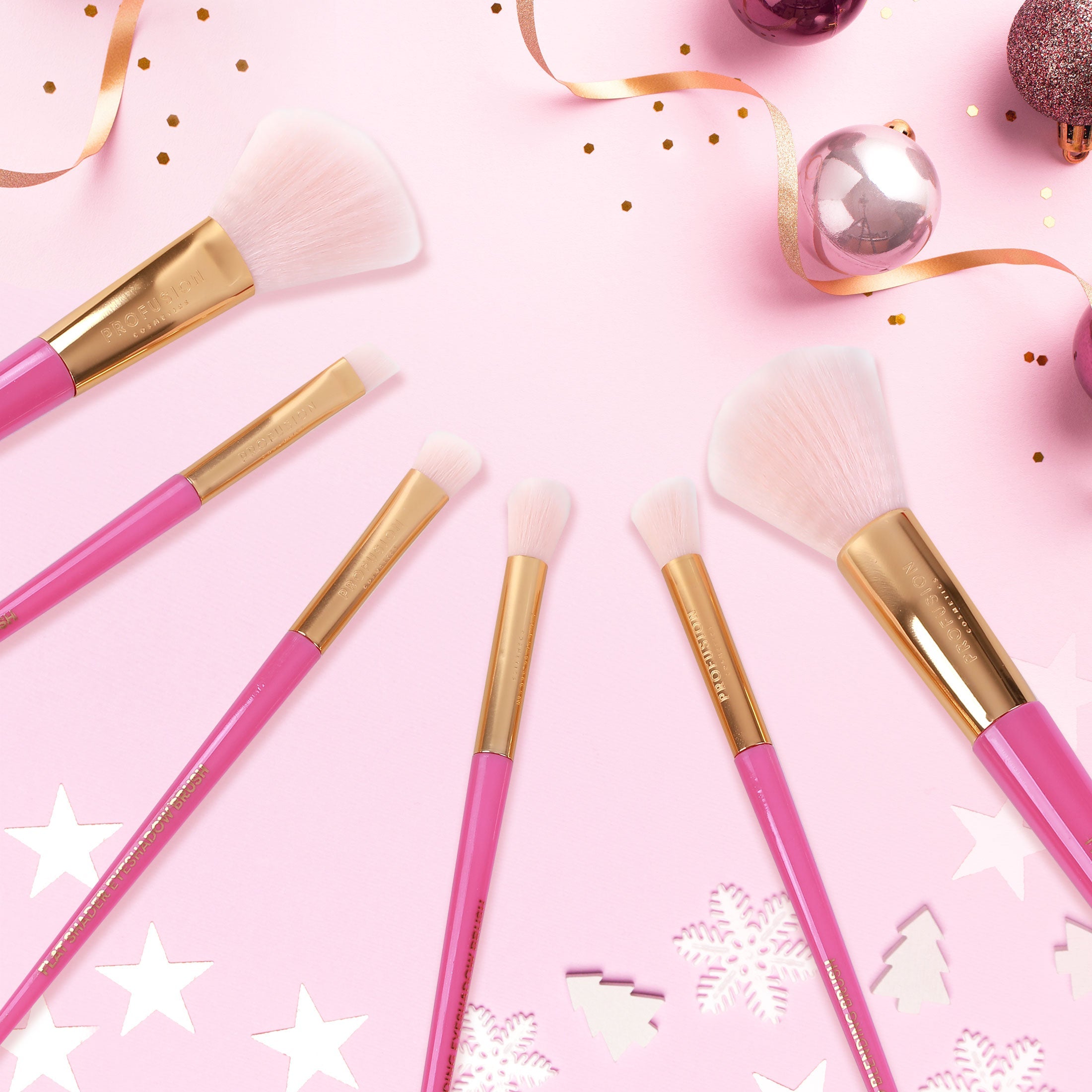 Set of six Profusion Cosmetics Sweet Holiday face and eye makeup brushes in a colorful vault display.