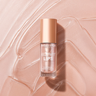 Profusion Cosmetics Glowy Lips Nourishing Shimmer Lip Oil showing a clear tube with shimmering lip oil and a shiny applicator wand.