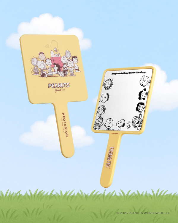 Profusion Cosmetics Peanuts 75th Social Club handheld mirror with cartoon design and compact tool for makeup and grooming.
