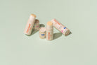 Pure Good LLC Tallow Lip Balm with citrus flavor, showcasing the natural balm in a small jar with a bright citrus scent.