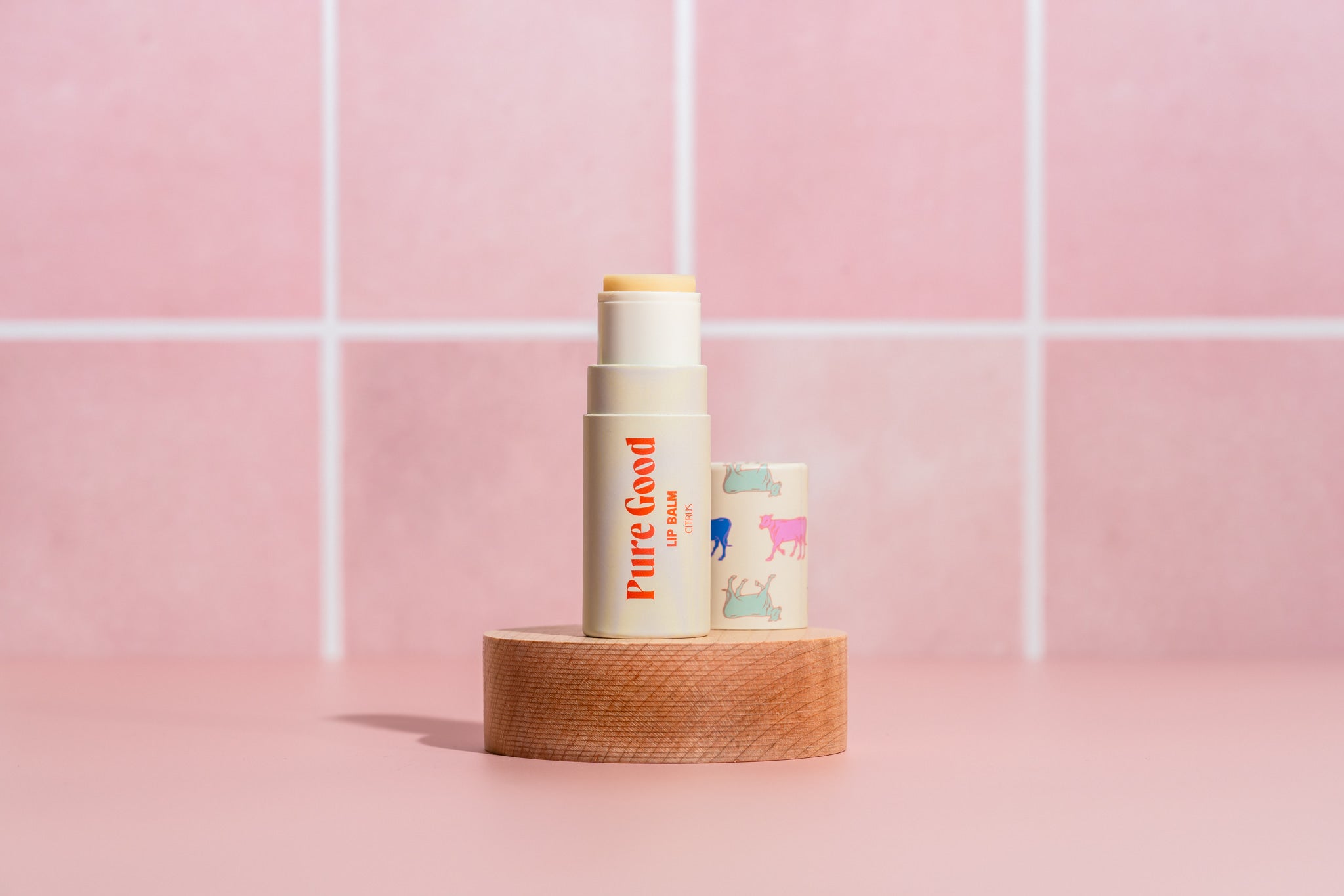 Pure Good LLC citrus tallow lip balm showing the natural lip balm stick with citrus scent and branding.