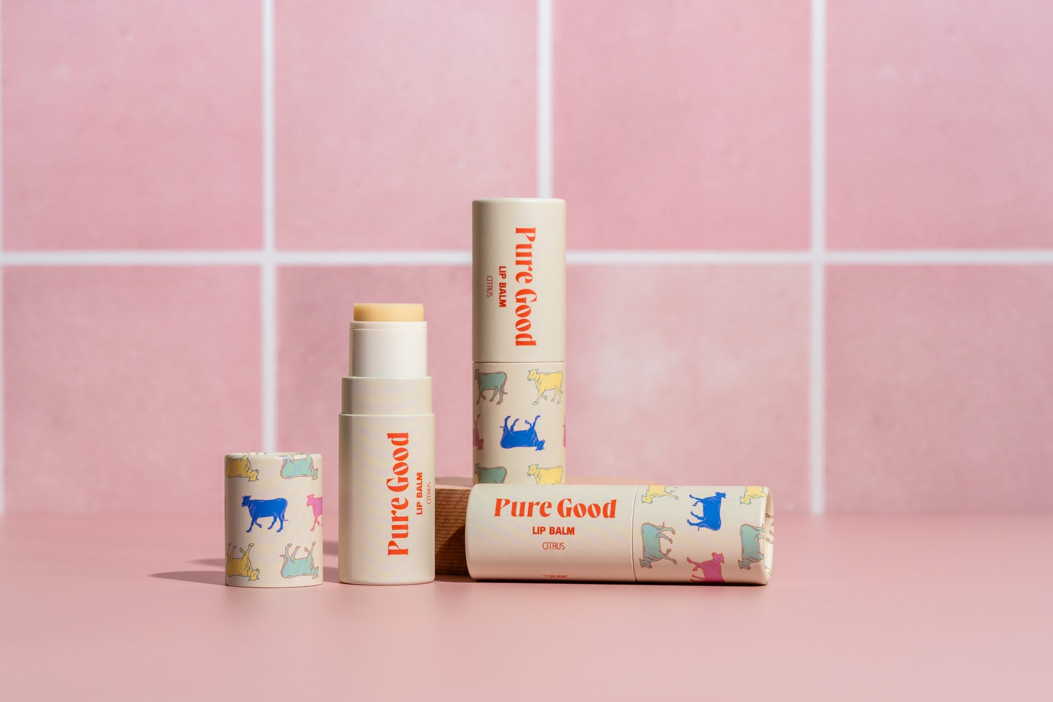 Pure Good LLC citrus tallow lip balm showing a natural balm tube with citrus flavor branding and smooth texture.