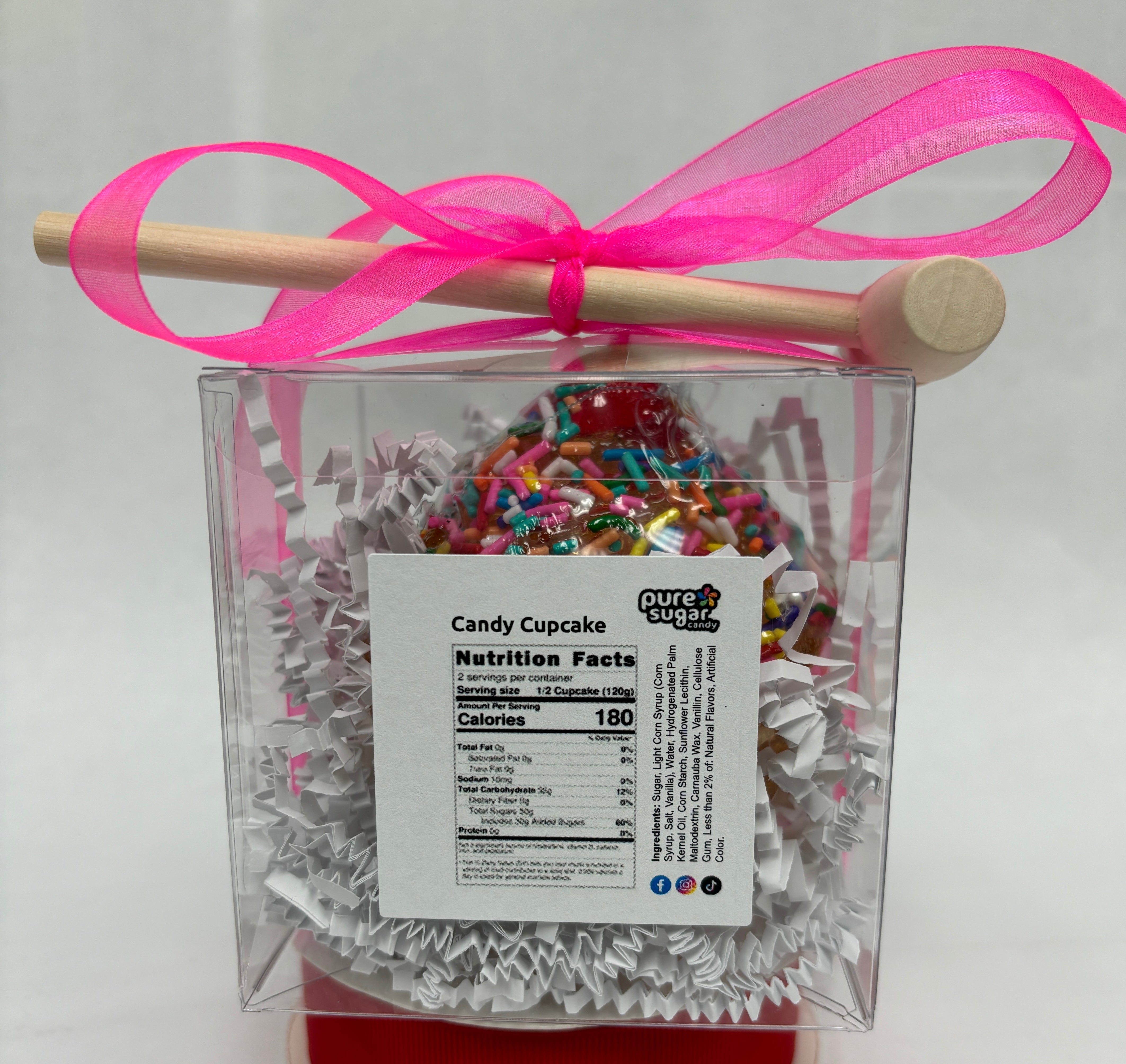 Hollow cupcake candy filled with colorful cupcake gummies, from Pure Sugar Candy, displayed with detailed frosting and candy interior.