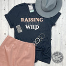 Raising Them Wild V-Neck SS Graphic Tee by The Graphic Tee, featuring a comfortable fit and bold nature-inspired design.