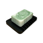 Black silicone soap dish from Refillism, designed for home and cleaning to hold soap and prevent messes.