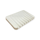 Black silicone soap dish from Refillism, designed for home and cleaning use, with a textured surface for soap drainage.