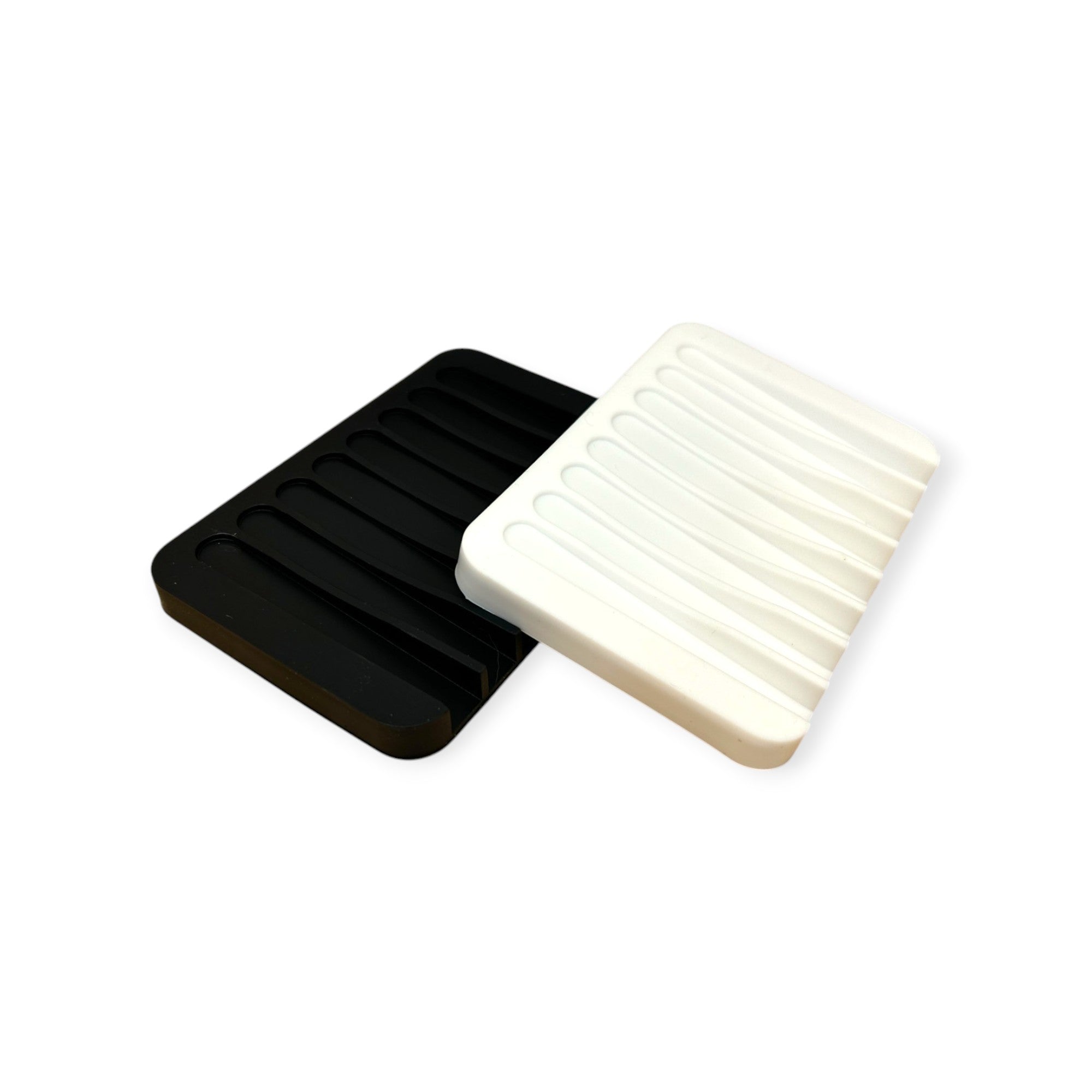 Black silicone soap dish from Refillism, designed for home and cleaning use, with a textured surface for soap drainage.