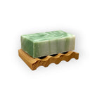 Wavy wooden soap dish by Refillism, designed for holding soap bars in home and cleaning spaces.