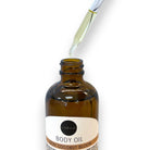 Refillism Silky Coconut Bloom Body Oil in a sleek bottle, perfect for nourishing and hydrating skin with tropical coconut scent.