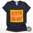 Reid 'Em And Weep black heather short sleeve crew neck graphic tee by The Graphic Tee, showing the front design and fabric texture.
