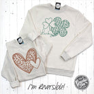 Reversible hearts to shamrocks cheetah print crewneck sweatshirt by The Graphic Tee, featuring bold graphic design and soft fabric.