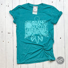 Roam Free teal crewneck short sleeve unisex graphic tee by The Graphic Tee, featuring a casual design and vibrant color.