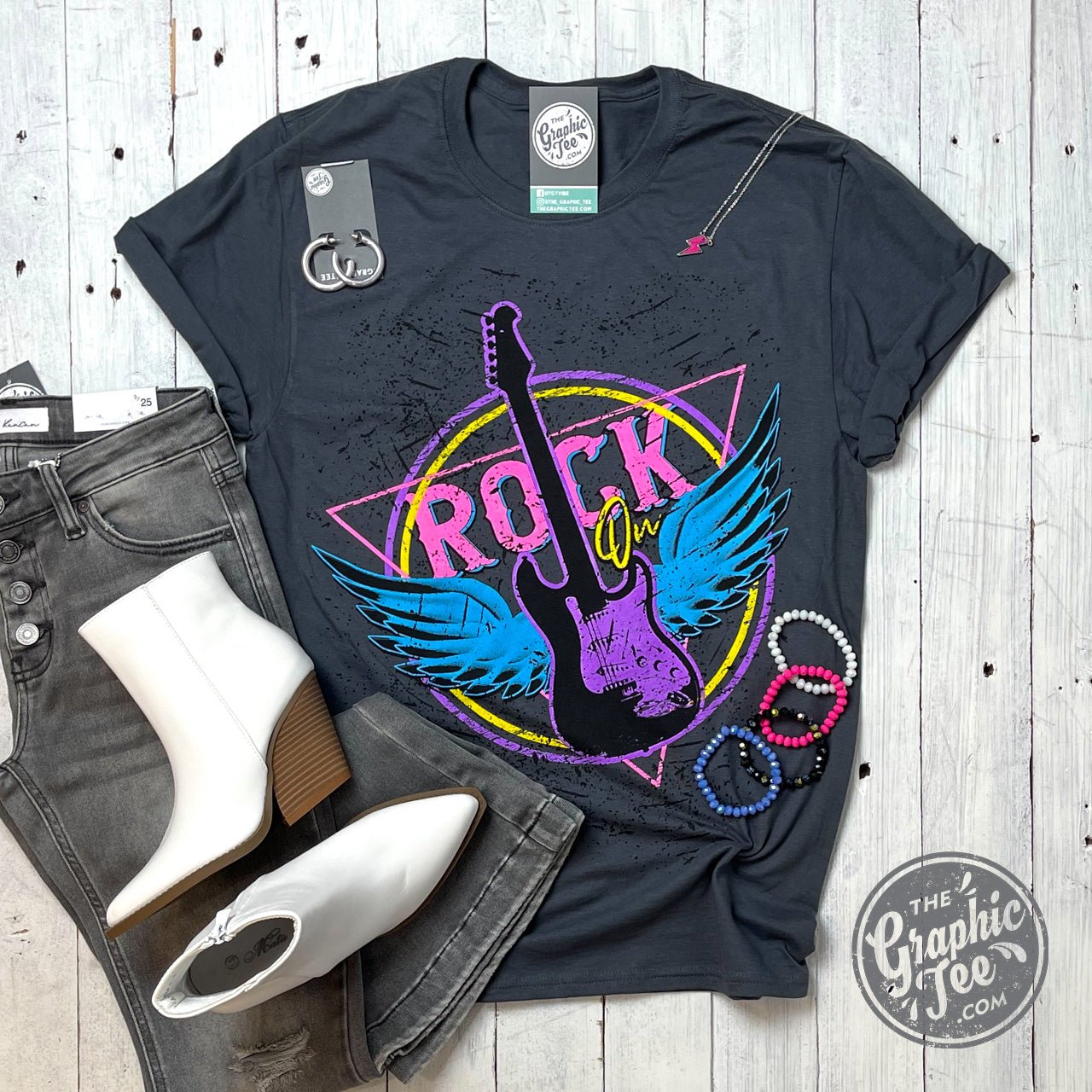 Black Rock On Grunge SS Graphic Tee by The Graphic Tee featuring a bold rock-inspired design on soft cotton fabric.