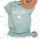 Short sleeve graphic tee by The Graphic Tee featuring "Run Like Mr. Collins Just Proposed" design on a casual men's t-shirt.