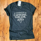 Women’s V-neck graphic tee featuring "Running on Caffeine, Sarcasm and Jesus" design, from The Graphic Tee.