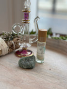 Sage & Stone Apothecary Goddess Perfume Roller with elegant glass bottle and stainless steel rollerball for body care fragrance application