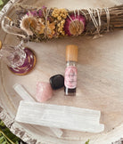 Sage & Stone Apothecary Goddess Perfume Roller with a sleek glass bottle and rollerball applicator for body scent.