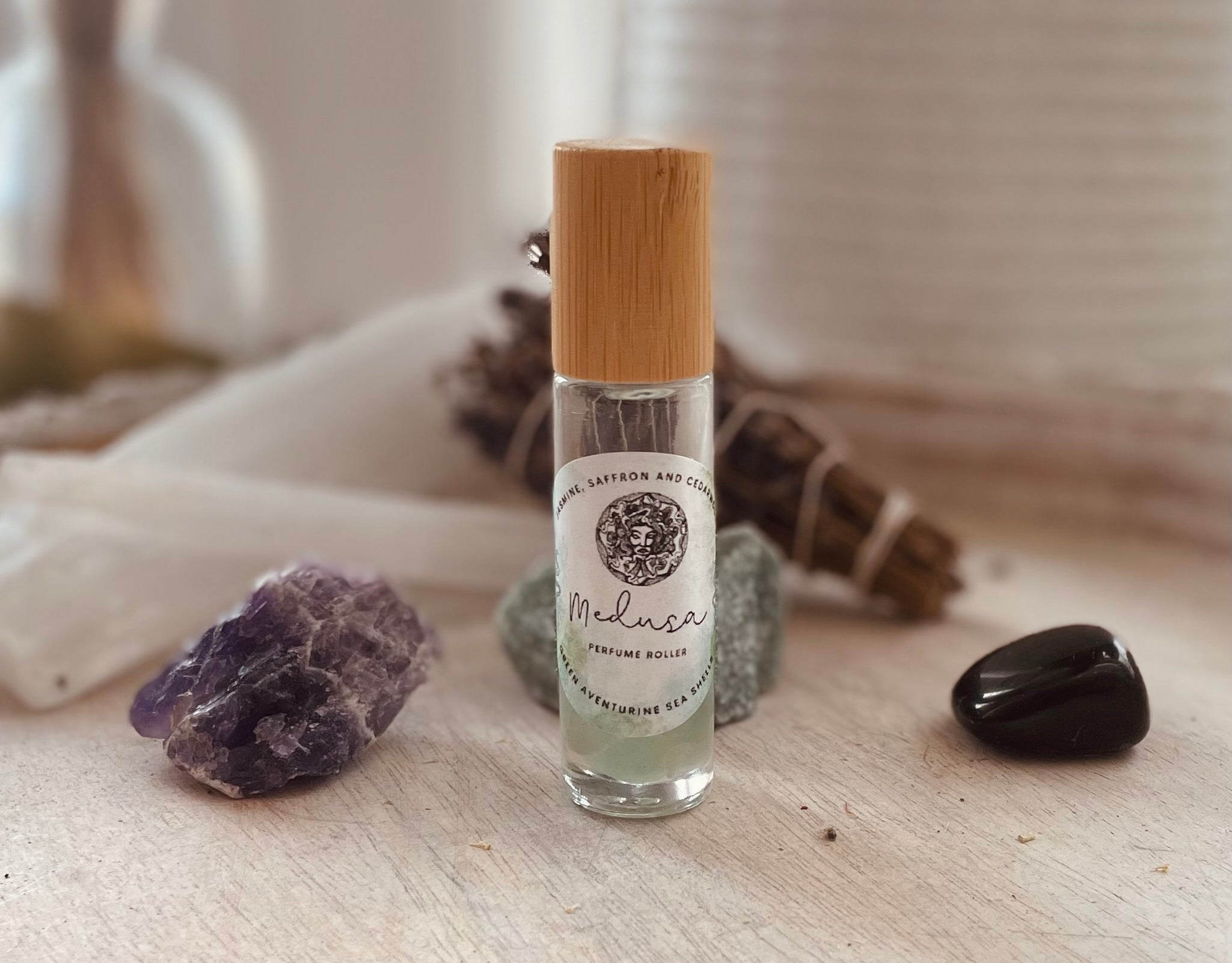Sage & Stone Apothecary Goddess Perfume Roller featuring a Medusa design for elegant body care fragrance application.
