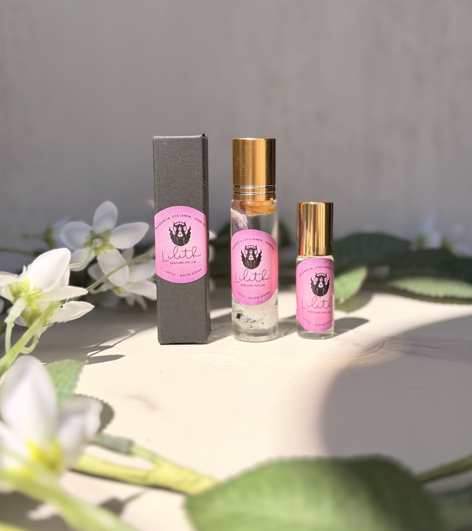 Sage & Stone Apothecary Goddess Perfume Roller with Lilith design, featuring a sleek body care roller bottle with intricate artwork.