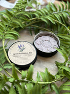 Lavender lotion bar by Sage & Stone Apothecary, a natural body care product with lavender scent and moisturizing texture.